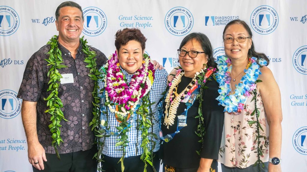 Diagnostic Laboratory Services team members at Best Places to Work event in Hawaii 2026 wearing lei