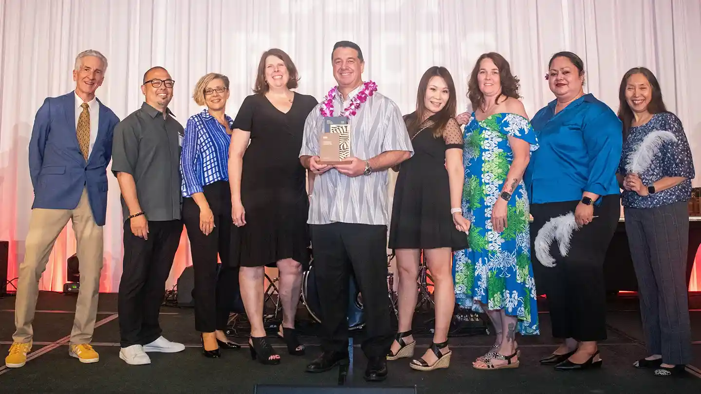 DLS team members on stage accepting 2026 Best Place to Work recognition in Hawaiʻi