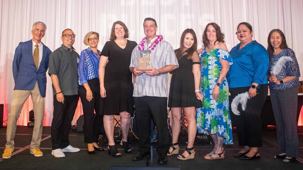 Diagnostic Laboratory Services team on stage receiving Best Places to Work award in Hawaii 2026
